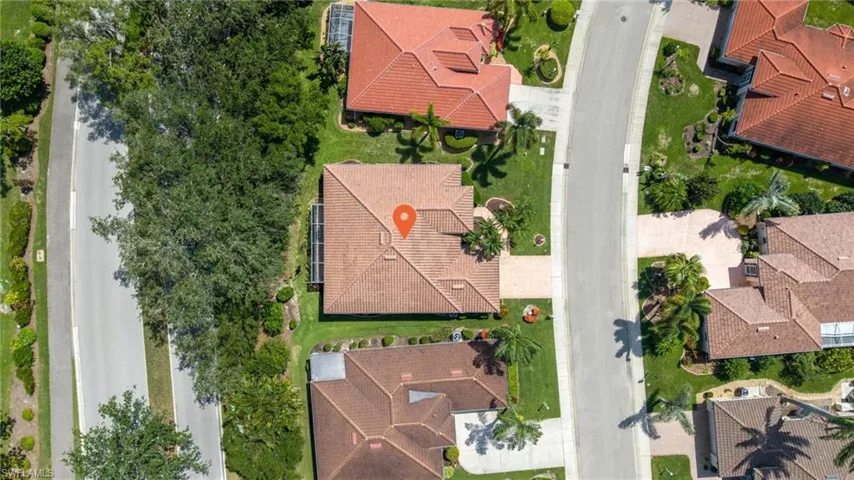 Aerial perspective showcasing a residential property with a terracotta tile roof