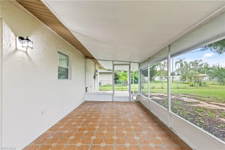 Unfurnished sunroom featuring plenty of natural light