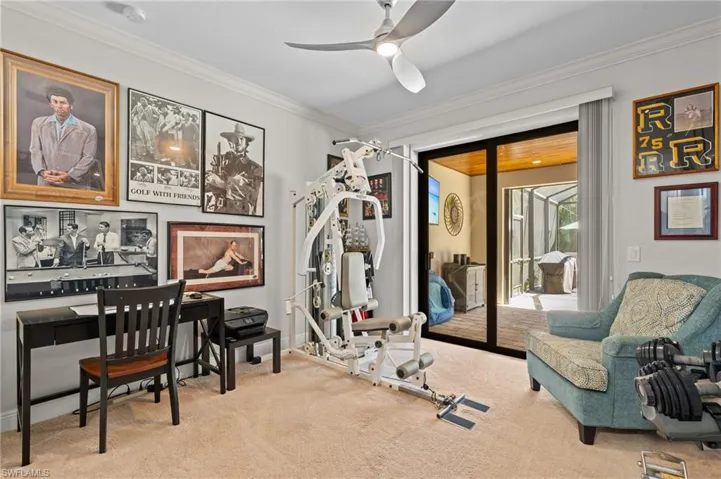 3rd bedroom with ornamental molding, baseboards, a ceiling fan, and carpet