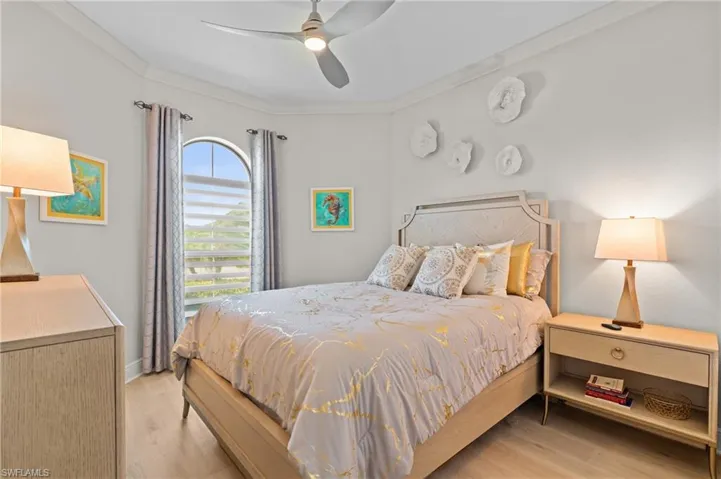 2nd Bedroom featuring crown molding, light wood-type flooring, and a ceiling fan