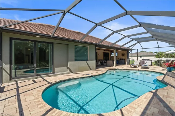 Pool with a lanai and a patio