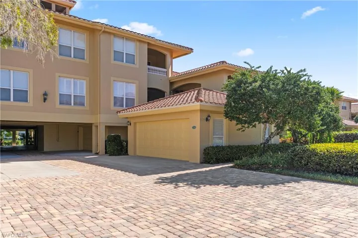 Mediterranean / spanish-style home featuring stucco siding, a garage, decorative driveway, and a tile roof