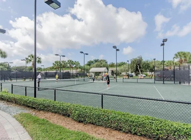 View of tennis court featuring a gazebo