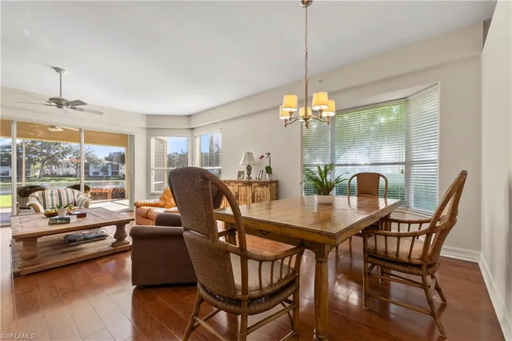 Dining space featuring hardwood / wood-style floors and a chandelier