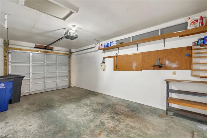 Garage featuring a garage door opener
