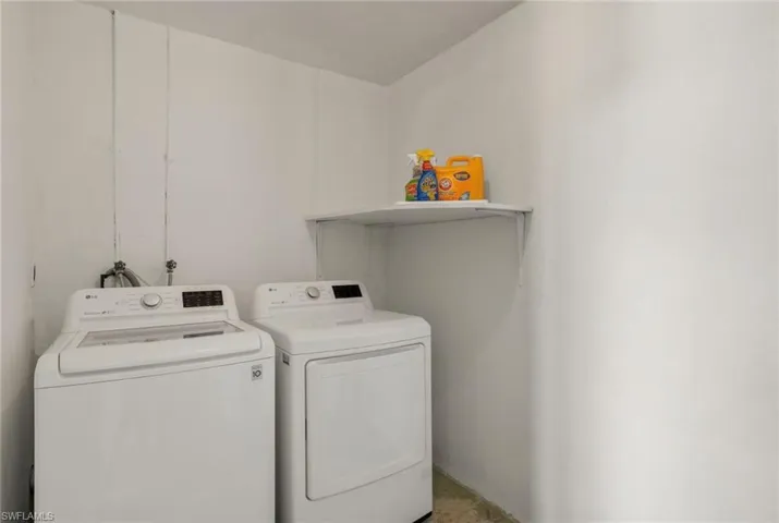 Laundry area featuring separate washer and dryer