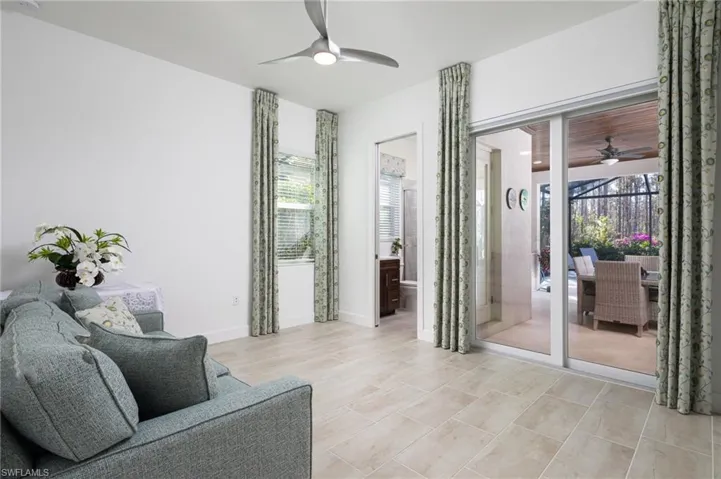 3rd Bedroom or Sitting Area with a ceiling fan and baseboards