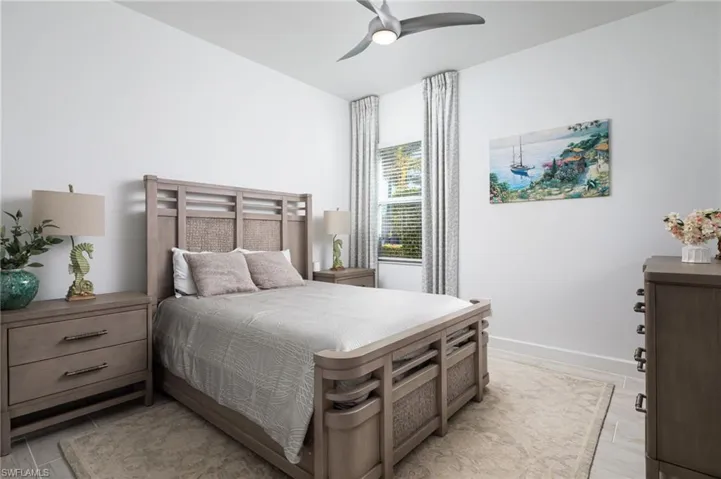 2nd Bedroom featuring ceiling fan and baseboards