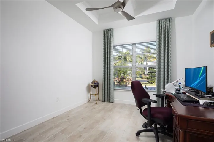 4th Bedroom or Office with a tray ceiling,  ceiling fan and walk-in closet.