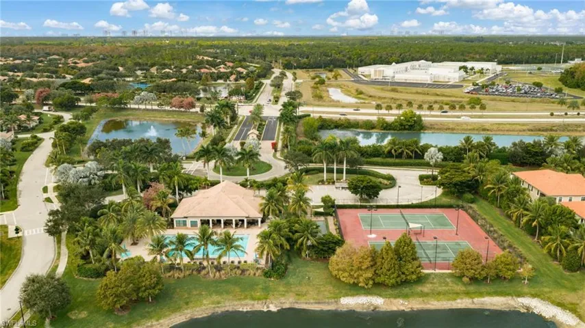 Residents enjoy exceptional community amenities, including a resort-style pool, tennis courts, a fitness center, and bocce courts.