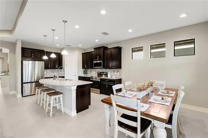 The kitchen also includes a convenient pantry closet and an adjoining dining area.