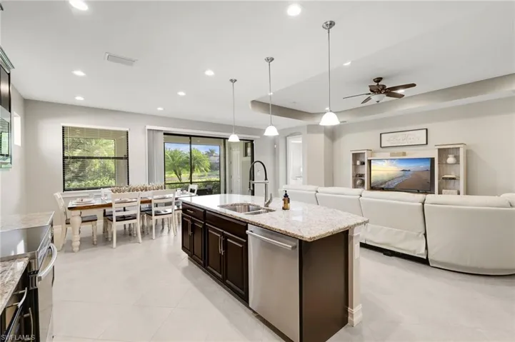 An alternate view from the kitchen showcases the bright, open-concept living space.
