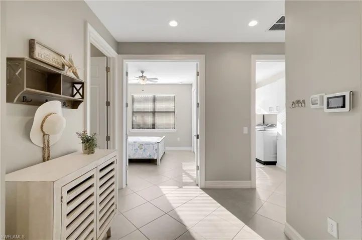 Bedroom two is conveniently located just steps from a full bathroom and the laundry room.
