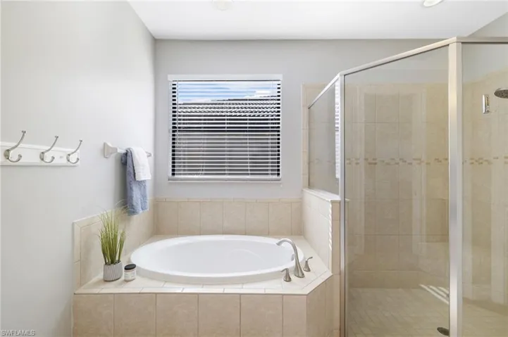 A closer look at the relaxing soaking tub and oversized walk-in tile shower.