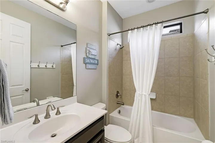 Conveniently located between bedrooms three and four, a shared full bathroom includes a tub/shower combination and single vanity.