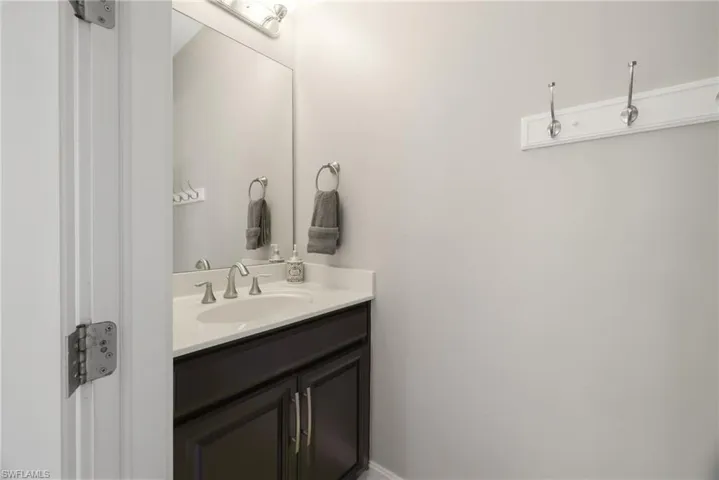 A look at the half bathroom accessible from the lanai.
