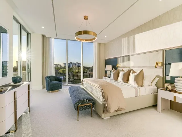 Bedroom with floor to ceiling windows