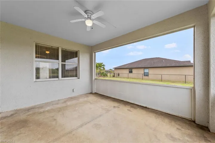 View of patio featuring a ceiling fan