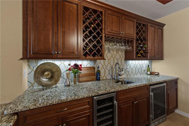 Wet bar features both a beverage & wine fridge