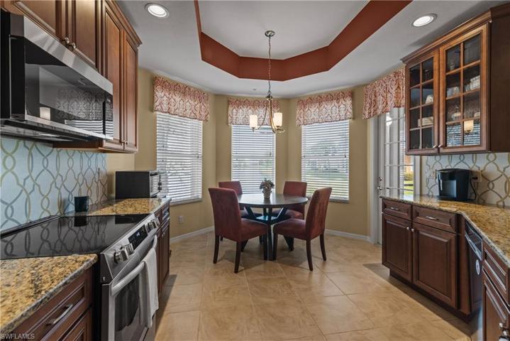 Stunning tray ceilings throughout add depth and elegance.