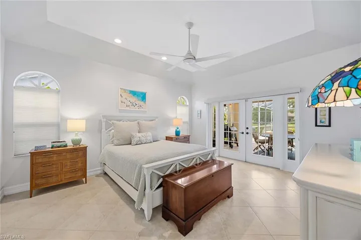Bedroom with french doors, access to exterior, multiple windows, recessed lighting, and a ceiling fan