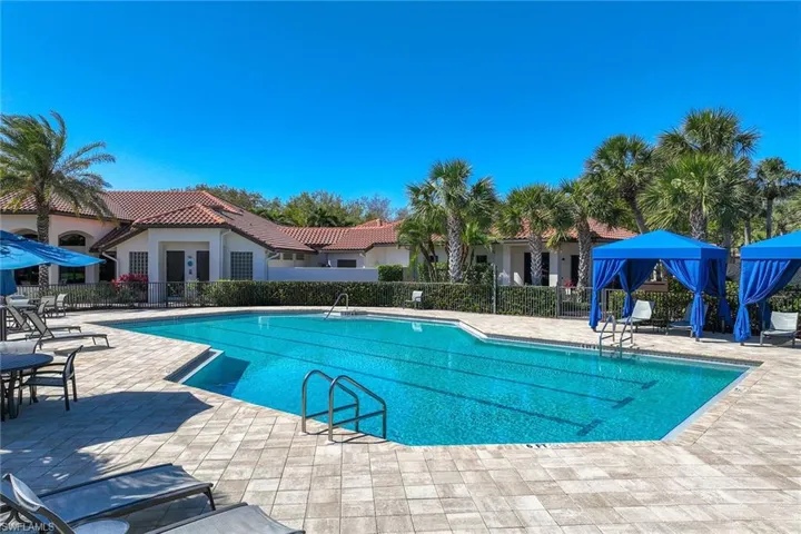 Community pool with a patio area