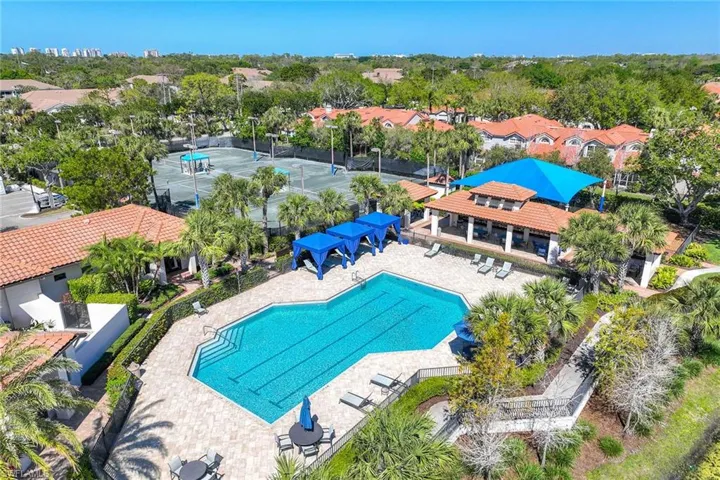 Community pool with a patio