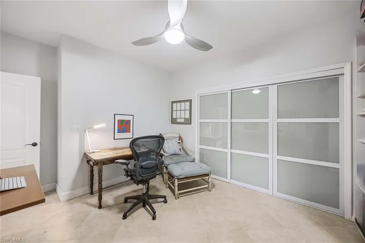 Home office with baseboards and a ceiling fan