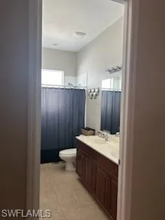 Bathroom featuring vanity and light tile patterned floors