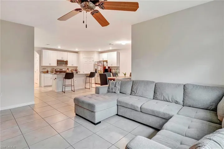 Tiled living room with ceiling fan