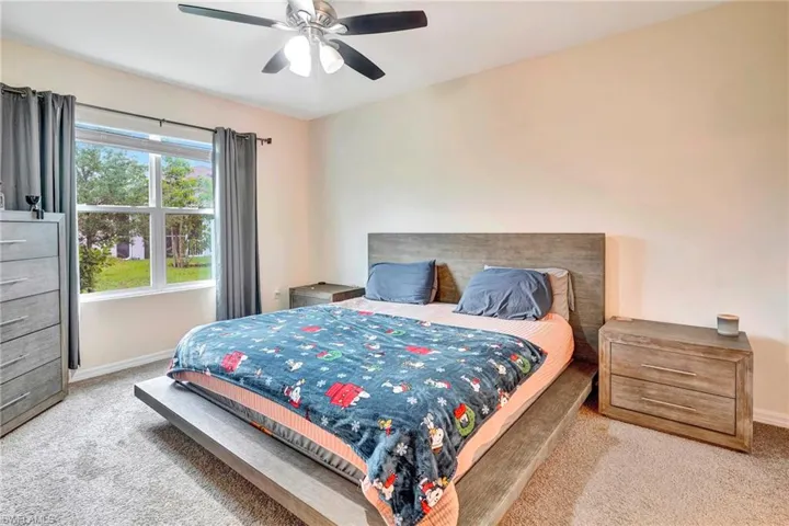 Bedroom with carpet flooring and ceiling fan