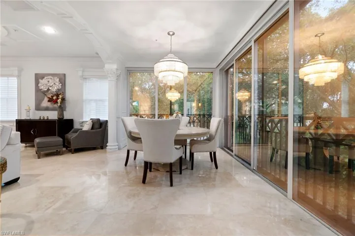 Glass sliders enclose the lanai and can be used as an air conditioned area or opened up to the outside overlooking the beautiful golf course.