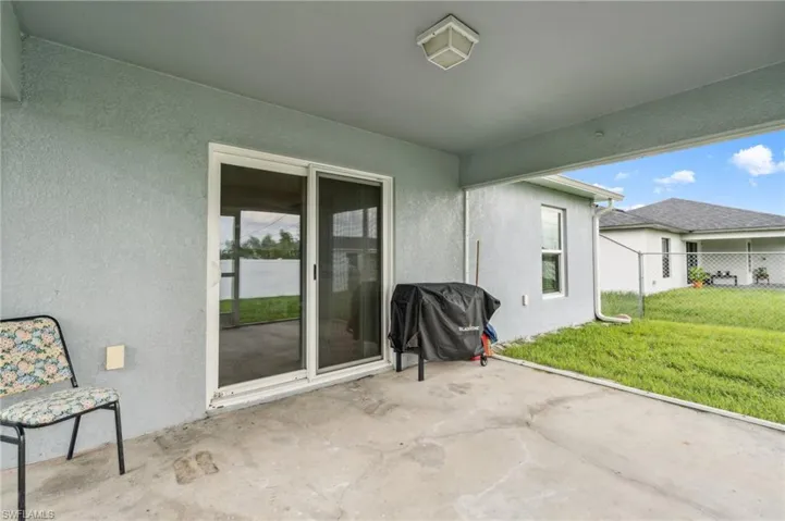 View of patio featuring a grill