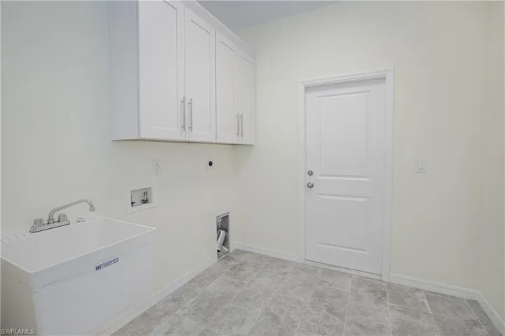 Inside laundry room with deep sink