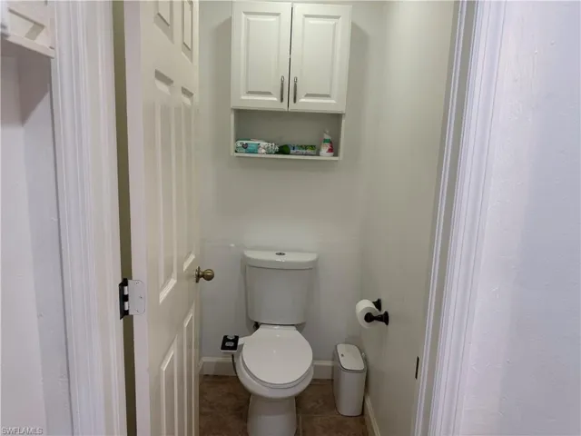 Master bathroom featuring private toilet