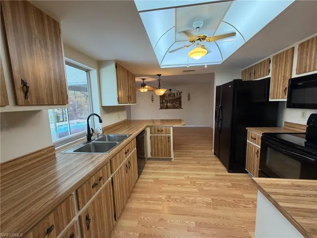 Kitchen featuring lots of cupboard space and a water view of canal