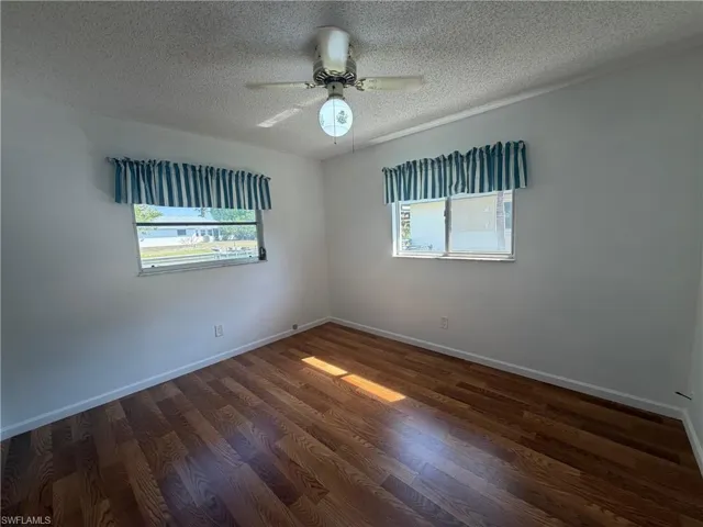 3rd Bedroom with a walk in closet and a view of canal