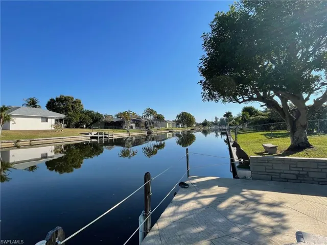 Dock featuring a water view and a residential view
