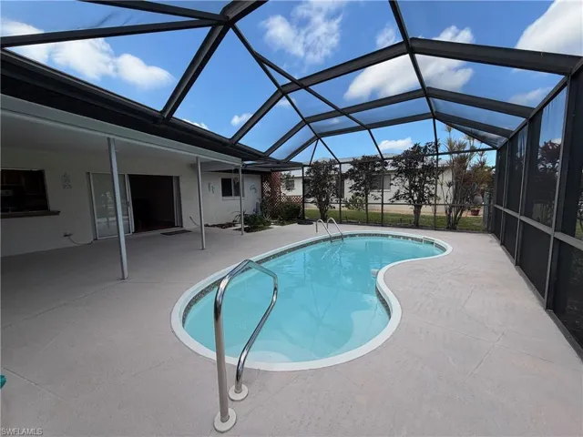 screened in pool area over looking canal