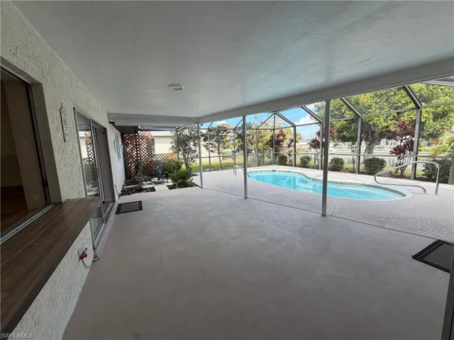 Covered lanai area with a Passover window to the kitchen