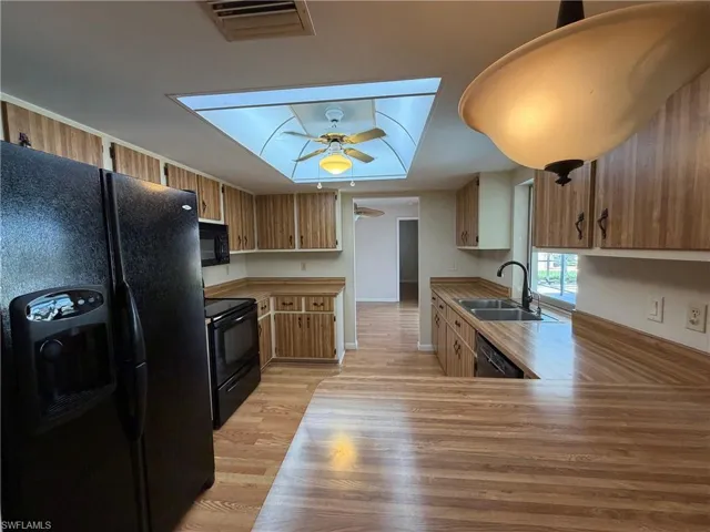 Kitchen with a view of pool and canal