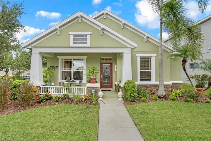 View of front of property featuring a front lawn and a porch