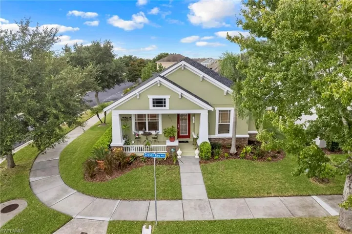 View of front facade with a front yard and a porch