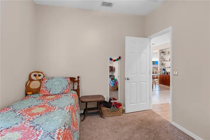 Bedroom with light tile patterned floors