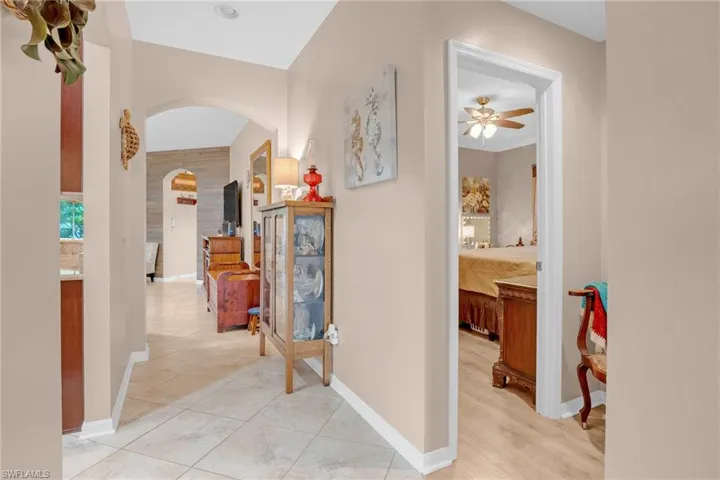Corridor with light hardwood / wood-style flooring