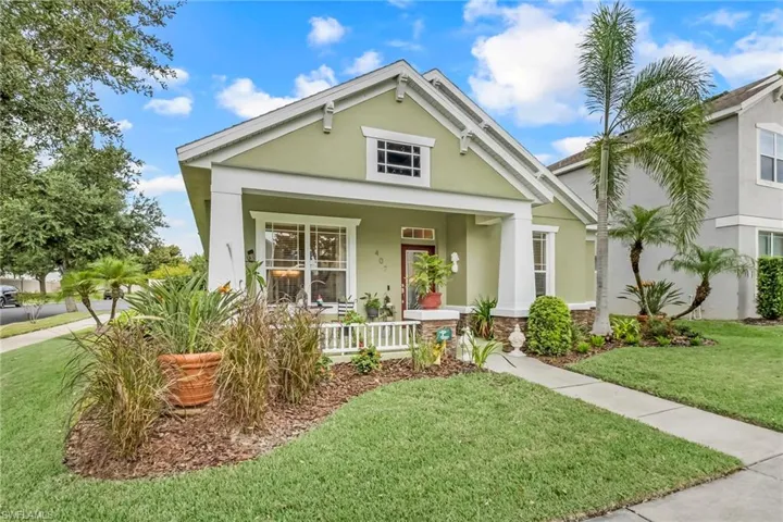 View of front of home featuring a front lawn and covered porch