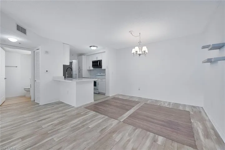 Living room, kitchen and dining room are open to one another.