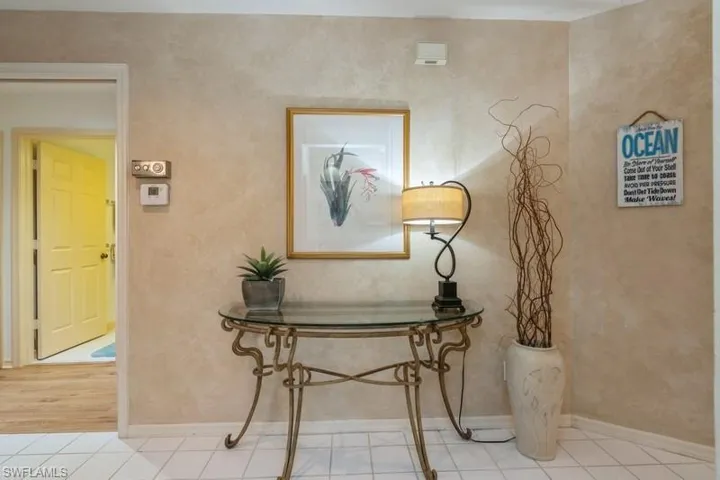 Hall with light hardwood / wood-style flooring