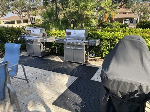 View of patio featuring area for grilling