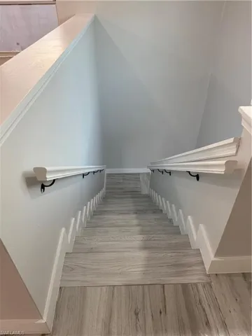 Stairs coming UP from foyer.